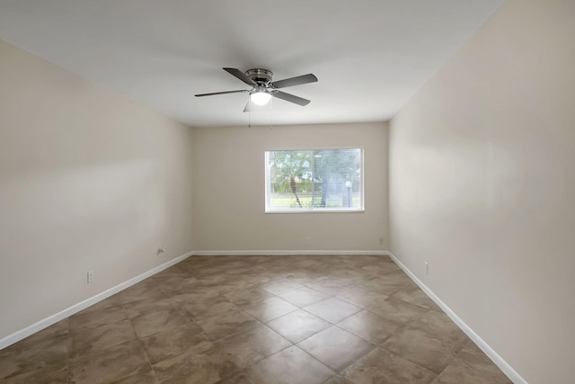 spare room with ceiling fan