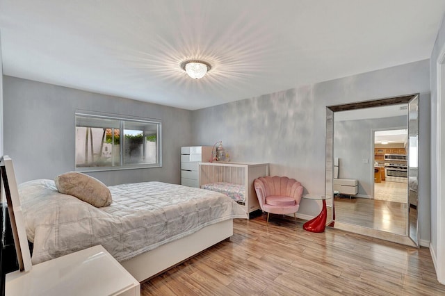 bedroom featuring light hardwood / wood-style floors