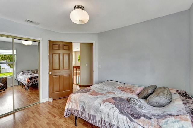 bedroom with a closet and light wood-type flooring