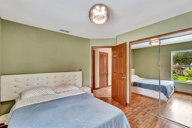 bedroom featuring light hardwood / wood-style floors and a closet