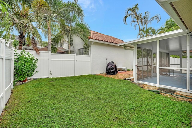 view of yard with a sunroom