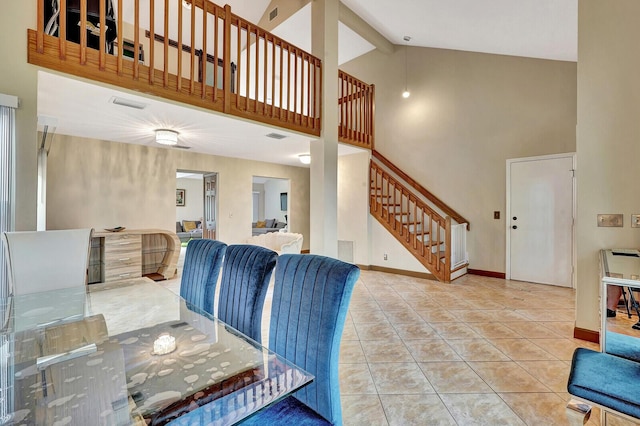 tiled living room with a high ceiling