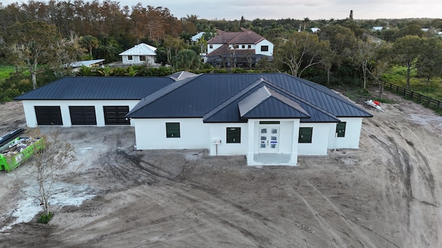 view of front facade featuring french doors and a garage