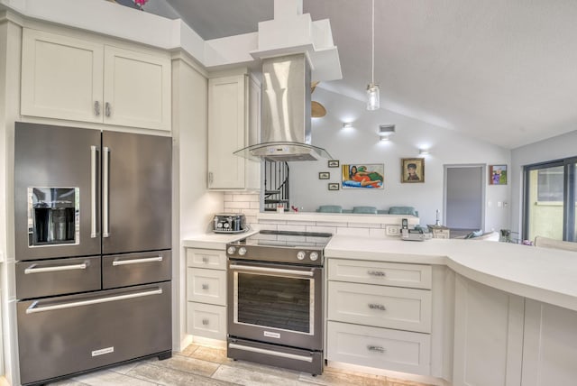 kitchen featuring island exhaust hood, stainless steel appliances, lofted ceiling, and light wood-type flooring