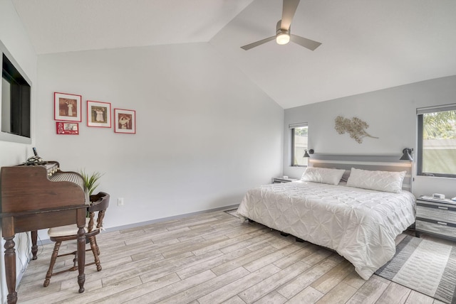 bedroom featuring ceiling fan, high vaulted ceiling, and light wood-type flooring