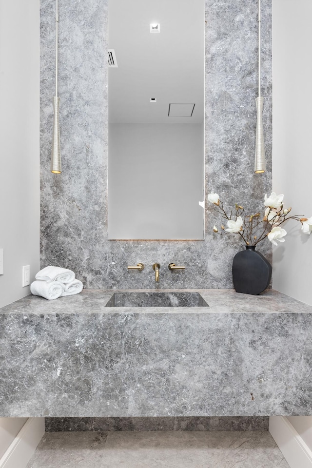 bathroom with concrete floors and sink