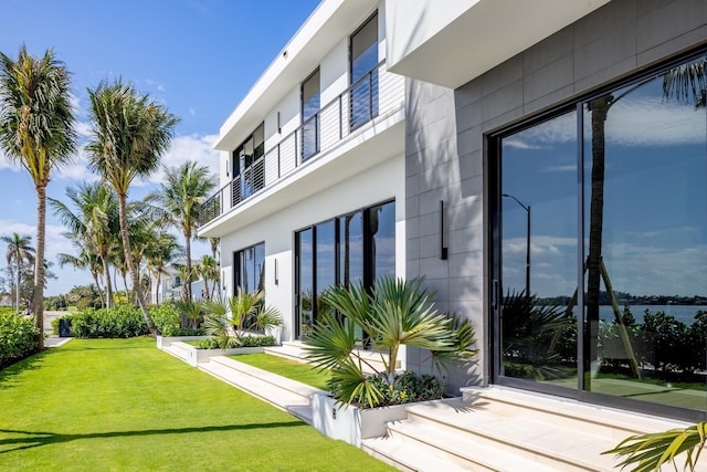 view of side of home featuring a yard