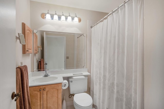 bathroom with tile patterned floors, vanity, toilet, and a shower with shower curtain