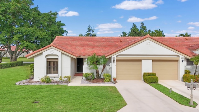 view of front of house featuring a front yard and a garage