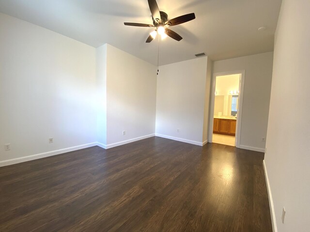 walk in closet featuring dark wood-type flooring