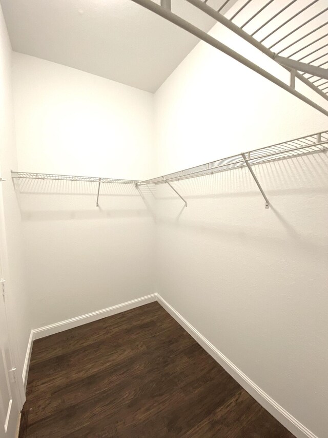 bathroom featuring toilet, a shower with door, tile patterned floors, and ceiling fan