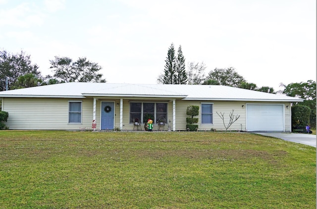 ranch-style home featuring a garage and a front lawn