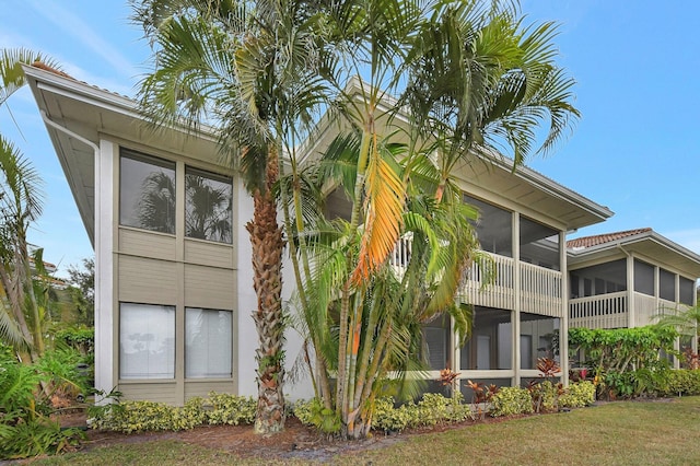 view of property exterior with a yard