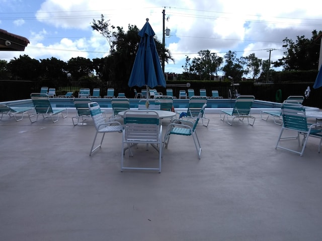 view of patio with a community pool