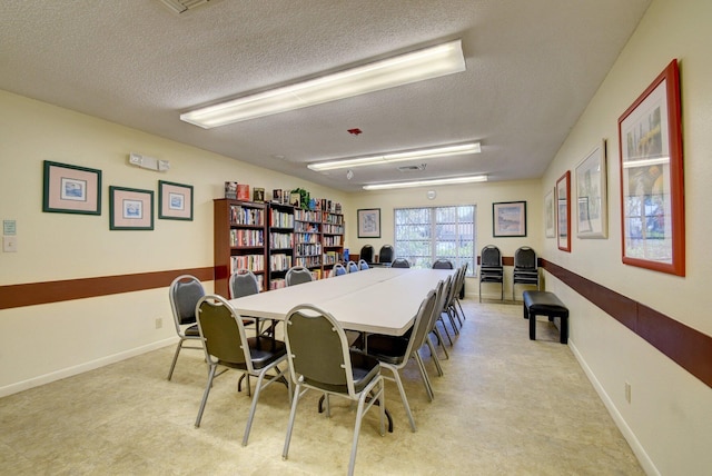 dining area with a textured ceiling