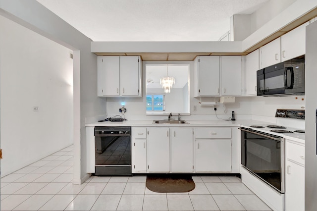 kitchen with black appliances, white cabinetry, and sink