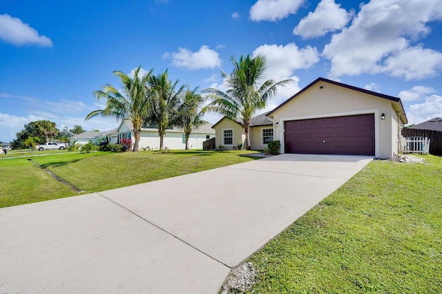 view of front facade with a garage and a front lawn