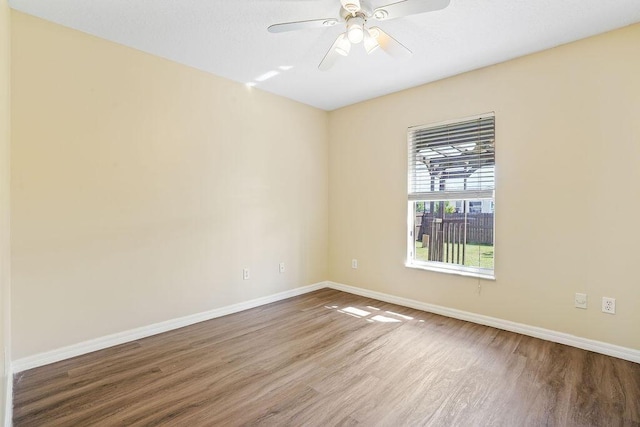 spare room featuring ceiling fan and hardwood / wood-style flooring