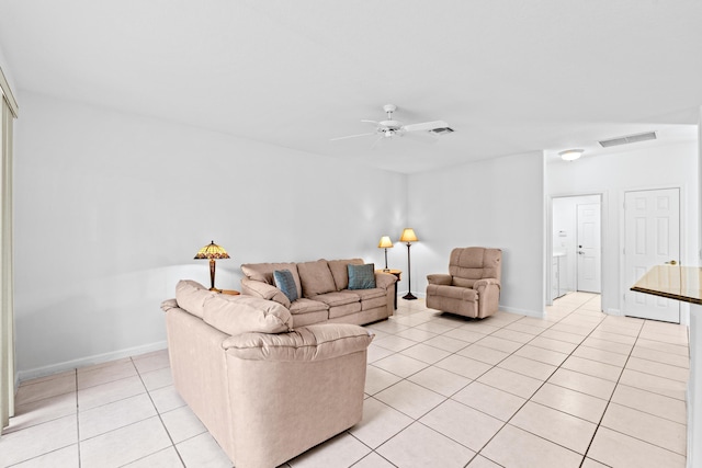 tiled living room with ceiling fan