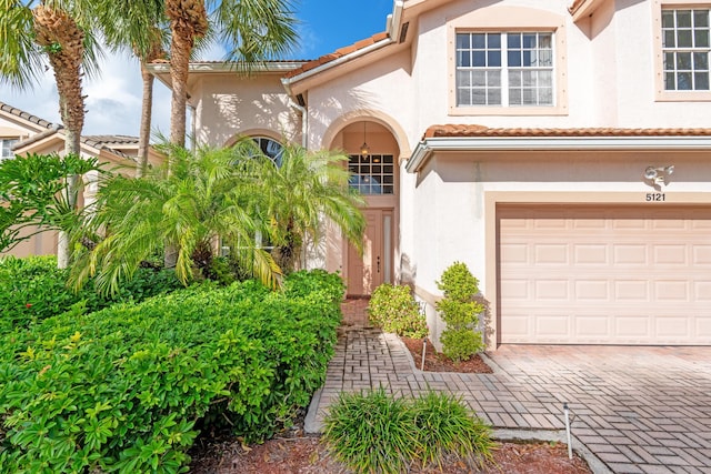 view of exterior entry with a garage