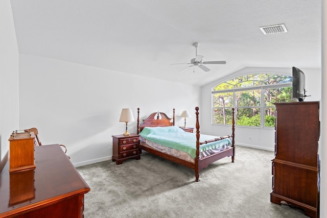 carpeted bedroom with ceiling fan and lofted ceiling