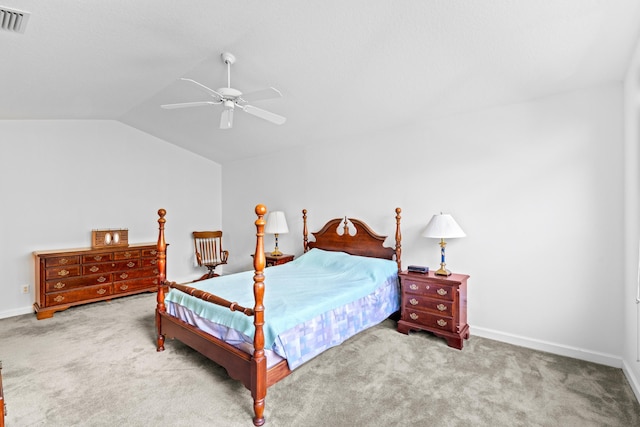 carpeted bedroom featuring ceiling fan and vaulted ceiling