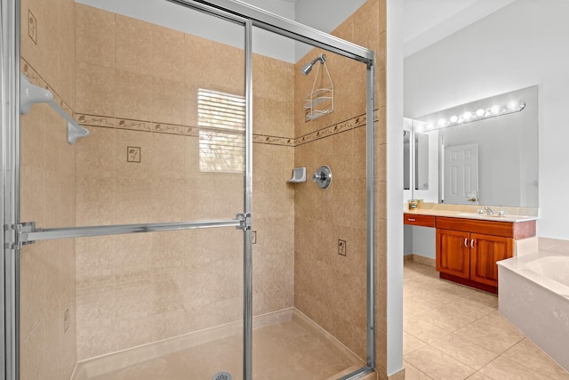 bathroom with tile patterned floors, vanity, and plus walk in shower