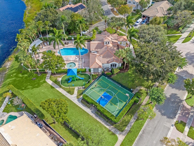 birds eye view of property with a water view