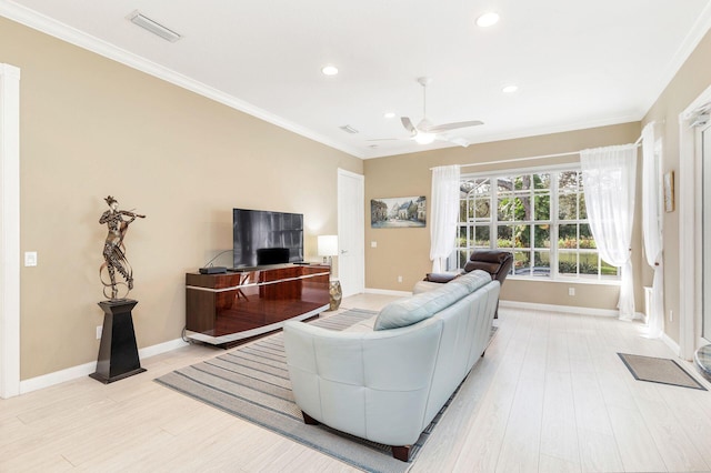 living room featuring light hardwood / wood-style flooring, ceiling fan, and ornamental molding