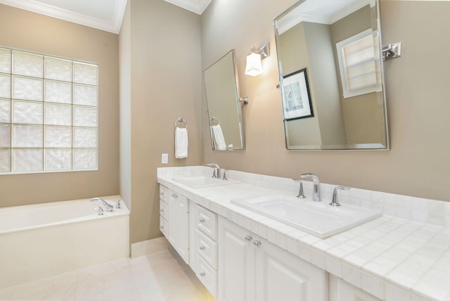 bathroom with tile patterned flooring, a bathtub, ornamental molding, and vanity