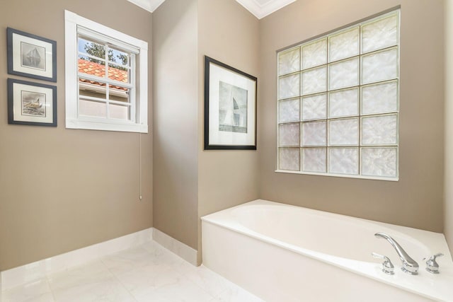 bathroom with a bathtub and ornamental molding