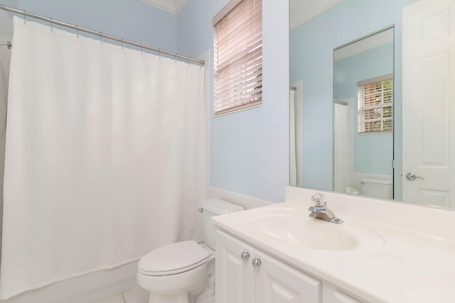 bathroom featuring tile patterned flooring, vanity, toilet, and ornamental molding