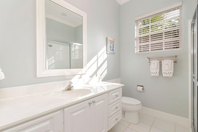 bathroom with tile patterned flooring, vanity, toilet, and a shower with door