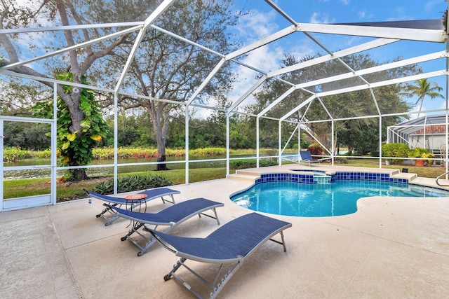 view of swimming pool featuring a patio area and a lanai