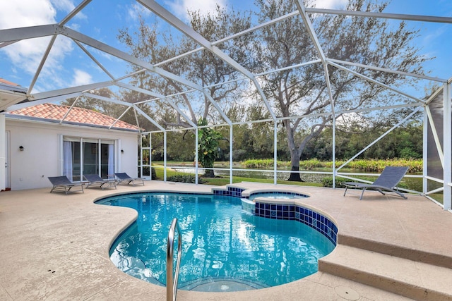 view of swimming pool with glass enclosure, an in ground hot tub, and a patio