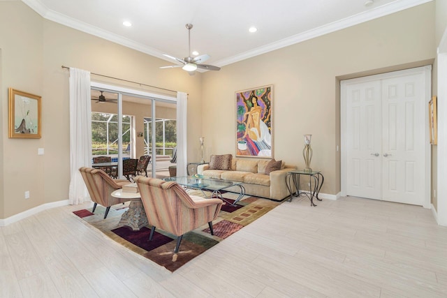 living room with light wood-type flooring, ceiling fan, and ornamental molding