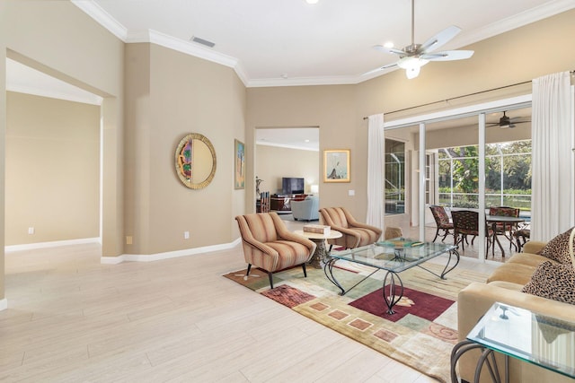 living room with light hardwood / wood-style floors, ceiling fan, and ornamental molding