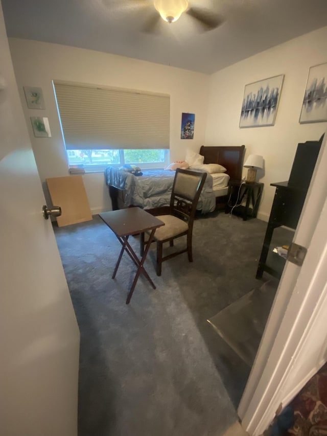 bedroom featuring dark colored carpet and ceiling fan