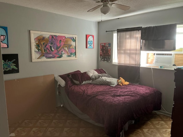 bedroom featuring parquet flooring, a textured ceiling, ceiling fan, and cooling unit