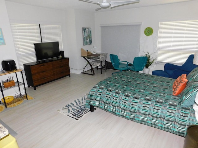 bedroom featuring ceiling fan and hardwood / wood-style flooring