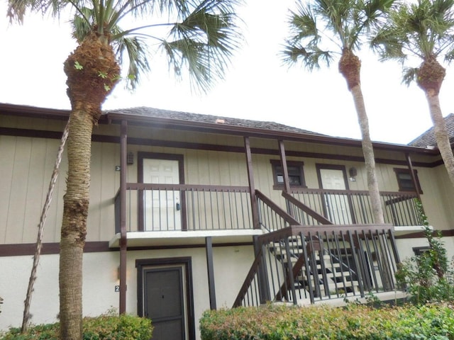 rear view of house featuring a balcony