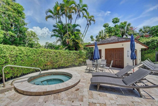 view of patio with an in ground hot tub