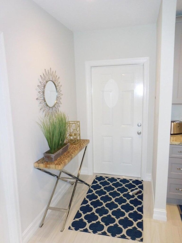 doorway to outside with light hardwood / wood-style flooring