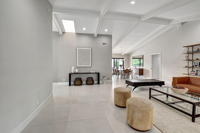 tiled living room with lofted ceiling with beams and billiards