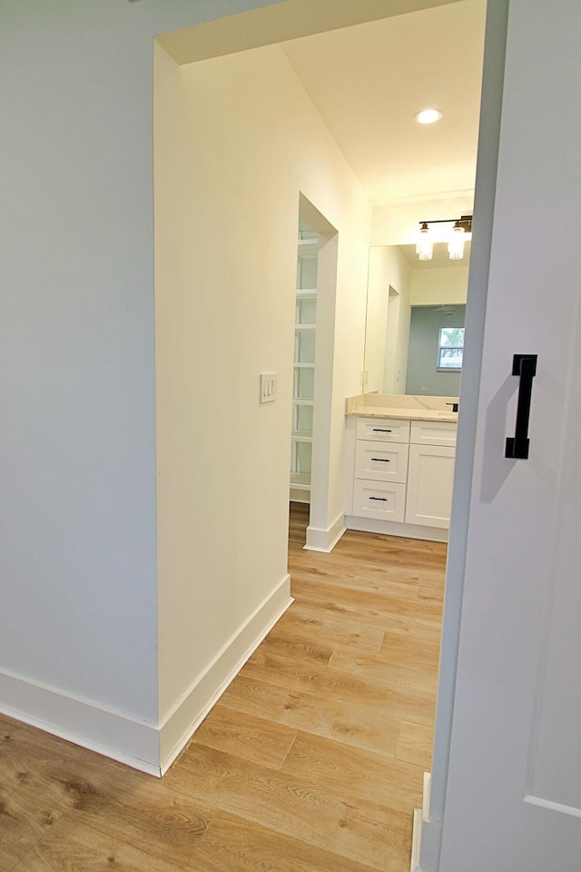 corridor featuring light hardwood / wood-style flooring