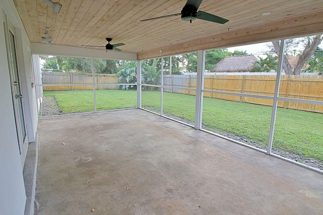 unfurnished sunroom with wooden ceiling