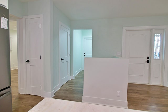 entryway with dark hardwood / wood-style floors