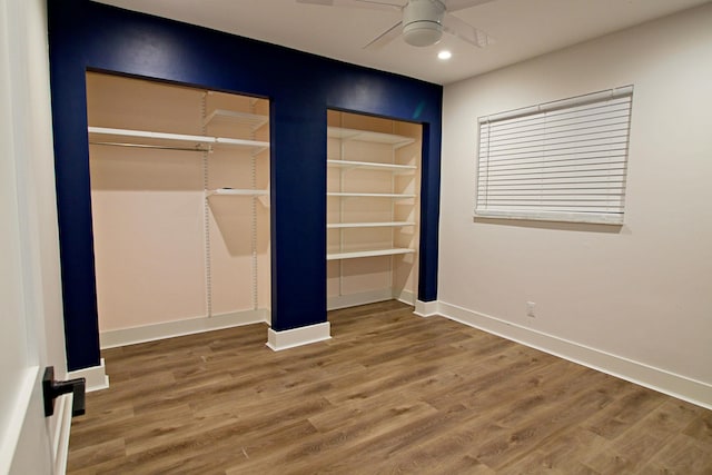 unfurnished bedroom featuring hardwood / wood-style flooring and ceiling fan