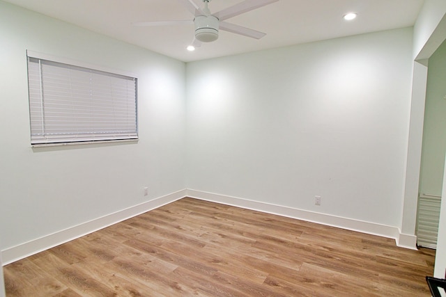 unfurnished room featuring ceiling fan and light wood-type flooring