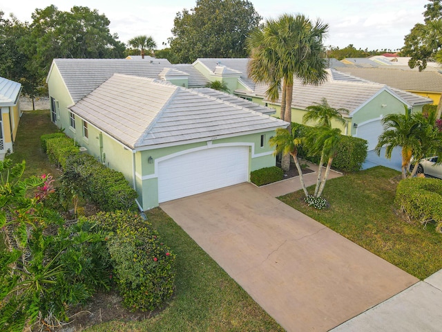 view of front facade with a front yard and a garage